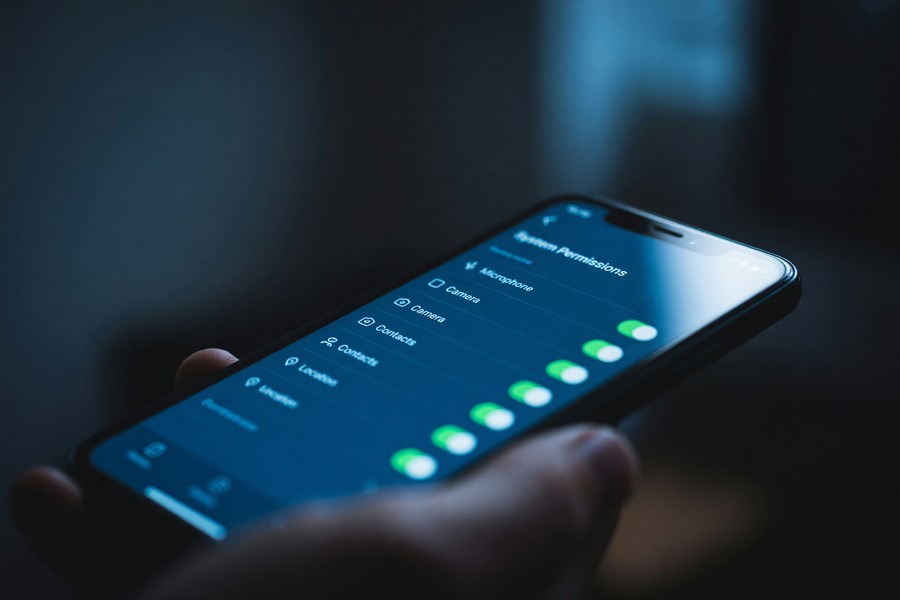 Infographic showing eight warning signs of a hacked messaging app with severity levels