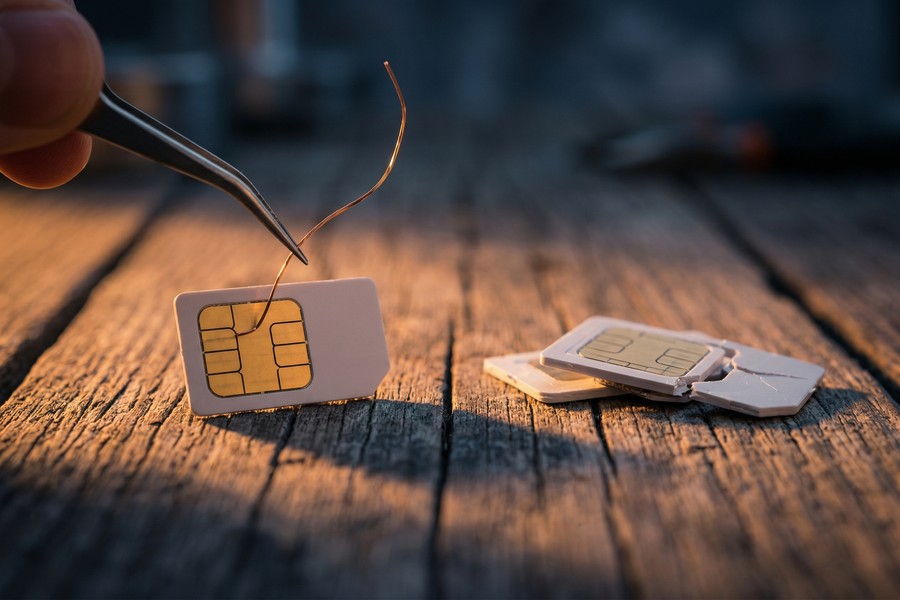 Diagram showing the step-by-step flow of a SIM swap attack targeting a victim's bank account