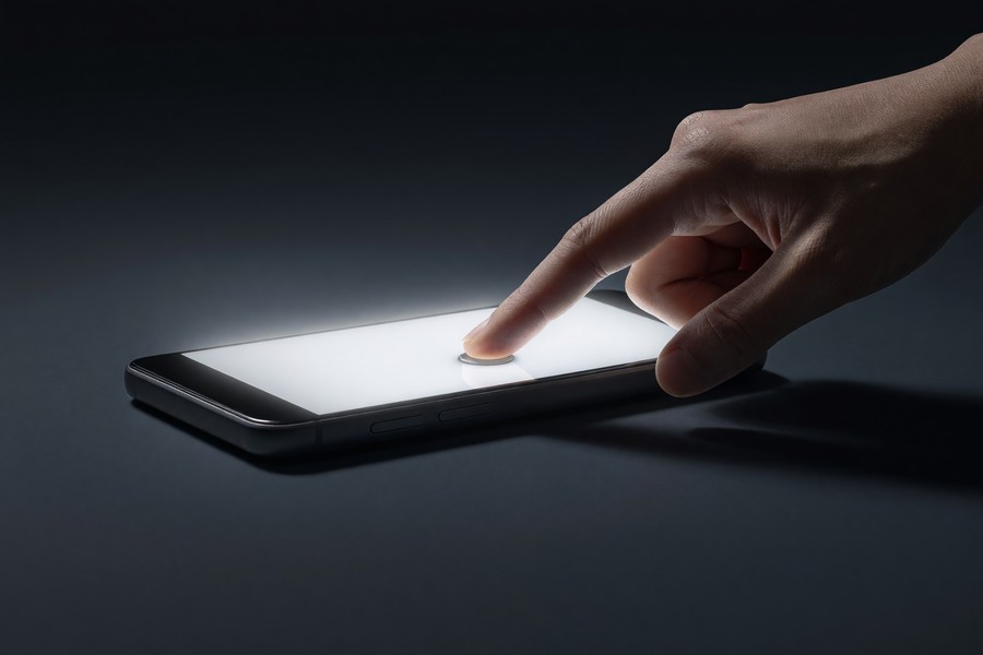 Person performing a factory reset on a smartphone via the settings menu
