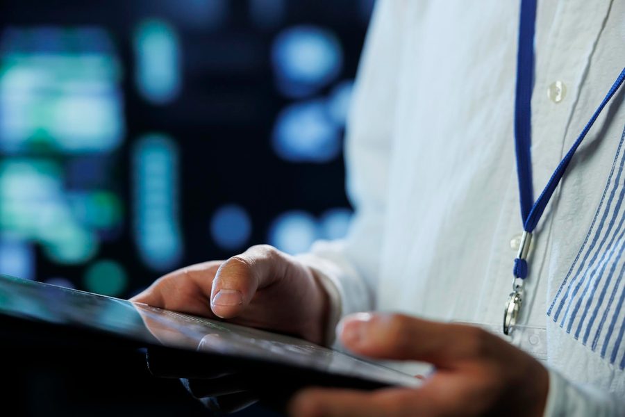 A person reviewing a password manager audit dashboard showing flagged health app logins