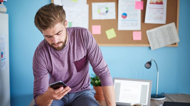 California college student using app limits on iPhone to manage screen time and improve study focus