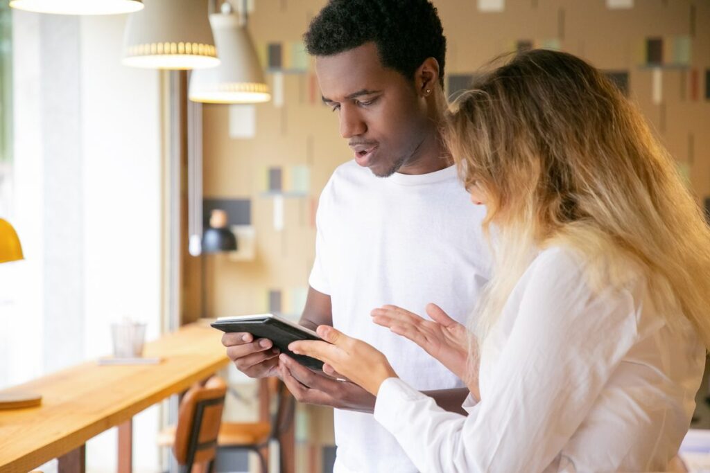 Therapist reviewing messaging app policy on tablet with HIPAA-compliant communication guidelines displayed