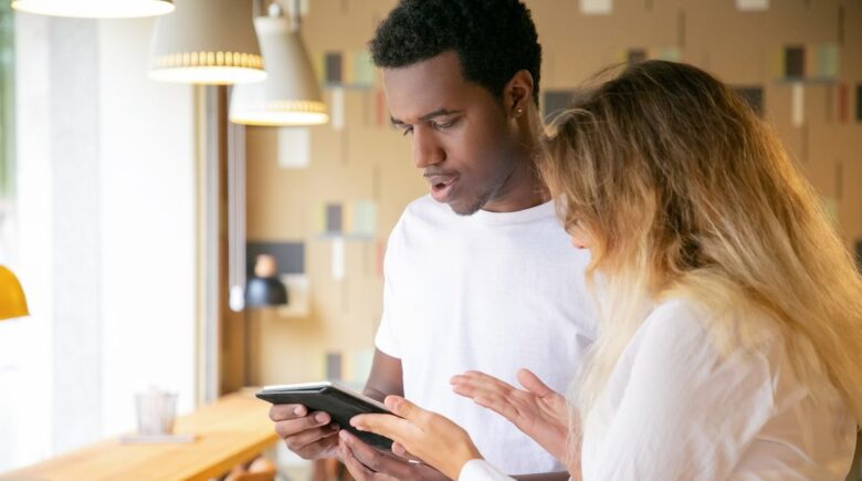 Therapist reviewing messaging app policy on tablet with HIPAA-compliant communication guidelines displayed