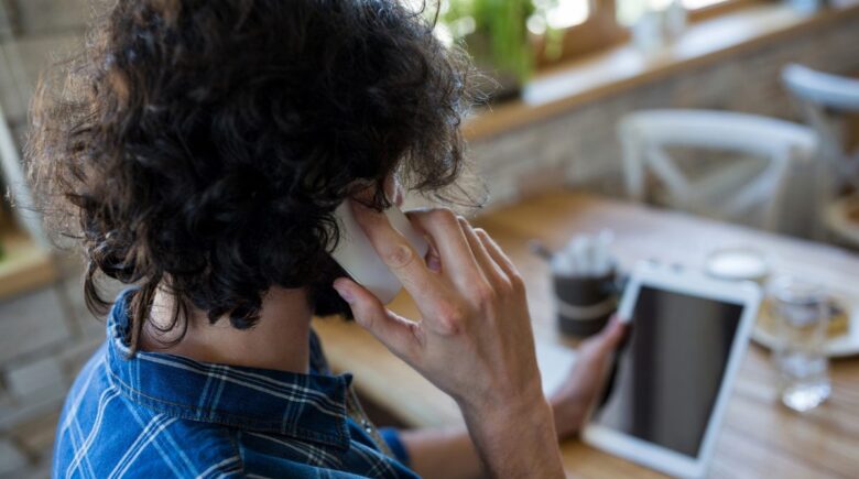 Remote worker using smartphone focus mode to reduce phone anxiety