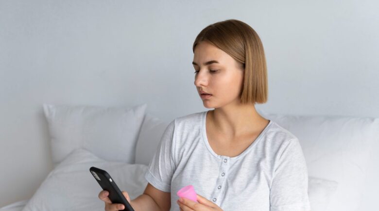 Comparison of period tracking app interface and hormone monitoring device displaying fertility data