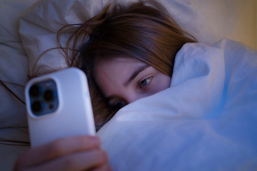 Phone on nightstand with low blue light setting